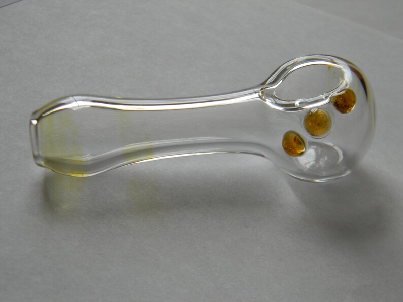 Spoon shaped with Green Amber Red or Blue grip dots comes with a free onnie. Hand Blown Fumed Glass Pipe