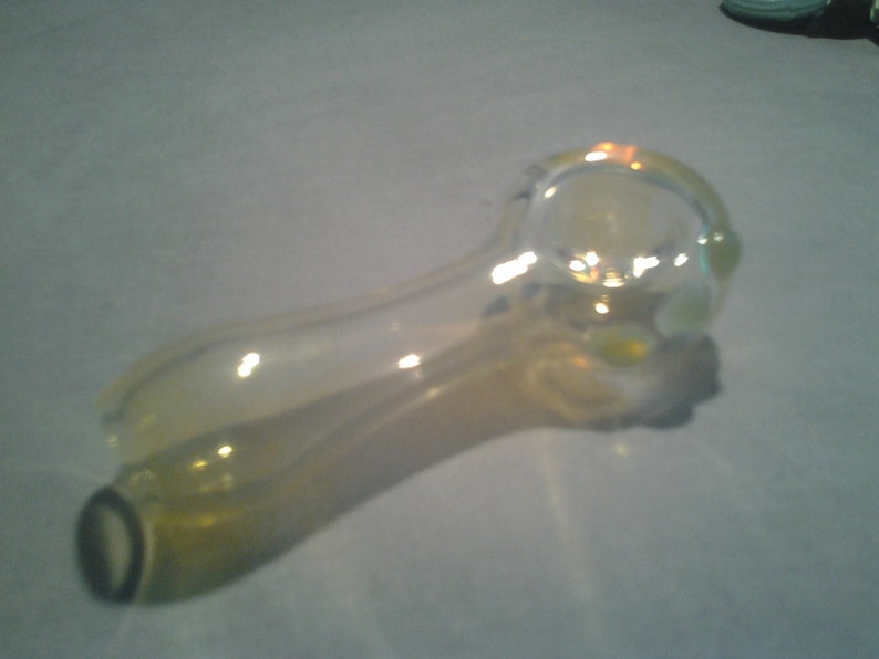 Spoon shaped with Green Amber Red or Blue grip dots comes with a free onnie. Hand Blown Fumed Glass Pipe