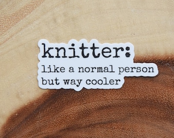 May include: White sticker with black text that reads "knitter: like a normal person but way cooler".