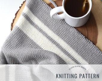 May include: Knitting pattern for a striped baby blanket in grey and white yarn. The pattern is called "Cluck Cluck Boots".