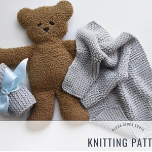 May include: Knitting pattern for a gray knitted baby blanket with a brown teddy bear and a blue ribbon. The pattern is titled "Cluck Cluck Boots Knitting Pattern".