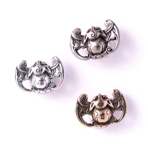 Bat Motif Metal Shank Button, a contemporary version of a traditional Chinese design symbolic of good fortune, longevity, and happiness.