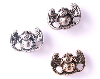 Bat Motif Metal Shank Button, a contemporary version of a traditional Chinese design symbolic of good fortune, longevity, and happiness.