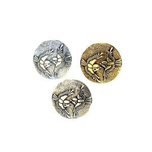 May include: Three round metal buttons with a design of two birds in flight. The buttons are silver, gold, and bronze.