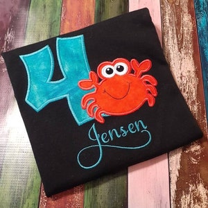 Crab Birthday T-Shirt. Machine applique and embroidery in your choice of colors.  Personalize with child's name and age.