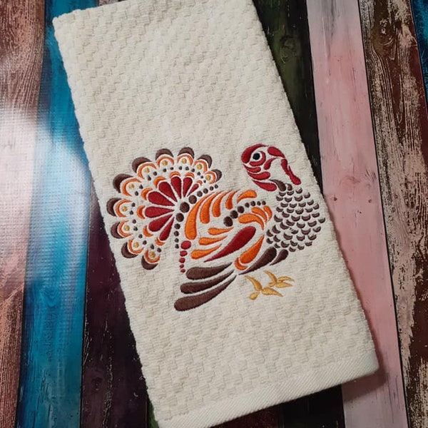 Turkey dish towel embroidered with Thanksgiving turkey.  Machine embroidered on cream waffle terry cloth dish towel.  15"x28"