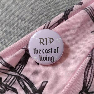RIP to The Cost Of Living Crisis Pastel Coloured Gothic Button Pin Badge