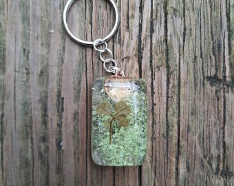 Real four leaf clover glow in the dark rectangle keychain