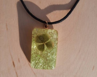 Real four leaf clover glow in the dark rectangle necklace on black cord