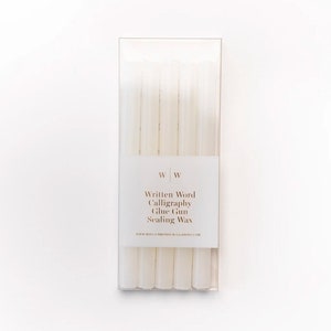 A pack of vellum sealing wax sticks for use with a glue gun. The pack is labelled "Written Word Calligraphy Glue Gun Sealing Wax".
