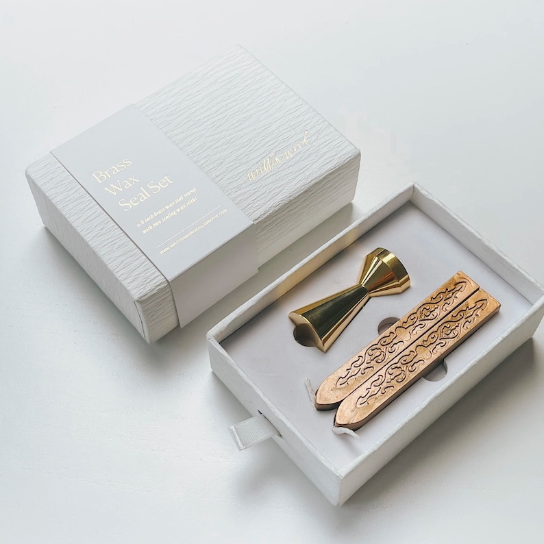 Brass wax seal set in a white box. The set includes a brass wax seal stamp and two sticks of wax. The box has the text "Brass Wax Seal Set" and "written word" printed on it.
