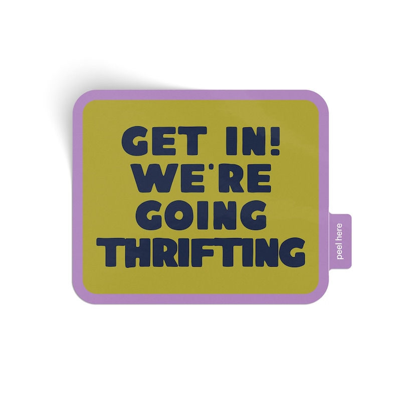 Bright green rectangular shaped sticker with rounded corners and purple border that says 'Get In! We're Going Thrifting!' and a easy peel tab on a white background