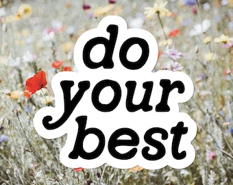 May include: White sticker with black text that reads "do your best" against a blurry background of a field of wildflowers.