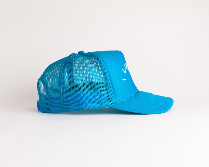 May include: A bright blue trucker hat with a white mesh back and a white logo that says "LIVE" on the front.