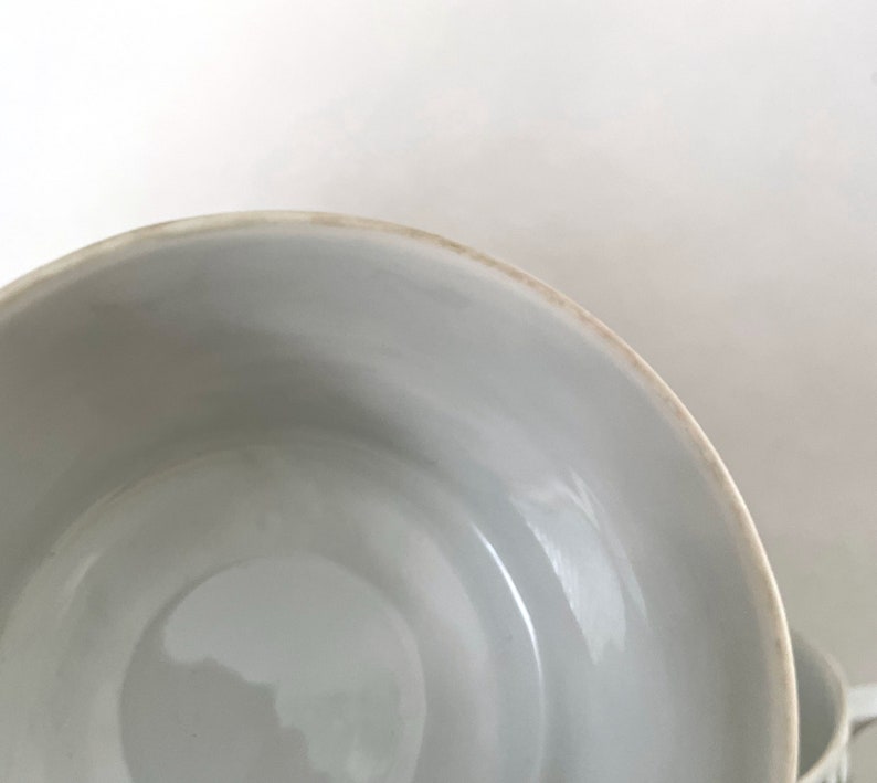 May include: White ceramic bowl with a smooth, slightly textured interior. The bowl is empty and appears to be new.