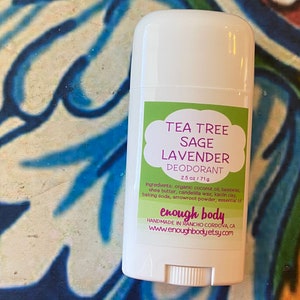 May include: White deodorant stick with a green and purple label that reads "Tea Tree Sage Lavender Deodorant 2.5 oz / 71g" and "enough body Handmade in Rancho Cordova, CA www.enoughbody.etsy.com"