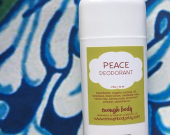 May include: A white deodorant stick with a green label that says "PEACE DEODORANT" and lists the ingredients: organic coconut oil, beeswax, shea butter, candelilla wax, kaolin clay, baking soda, arrowroot powder, essential oil. The label also says "enough body" and "HANDMADE IN RANCHO CORDOVA, CA" with the website address "www.enoughbody.etsy.com".