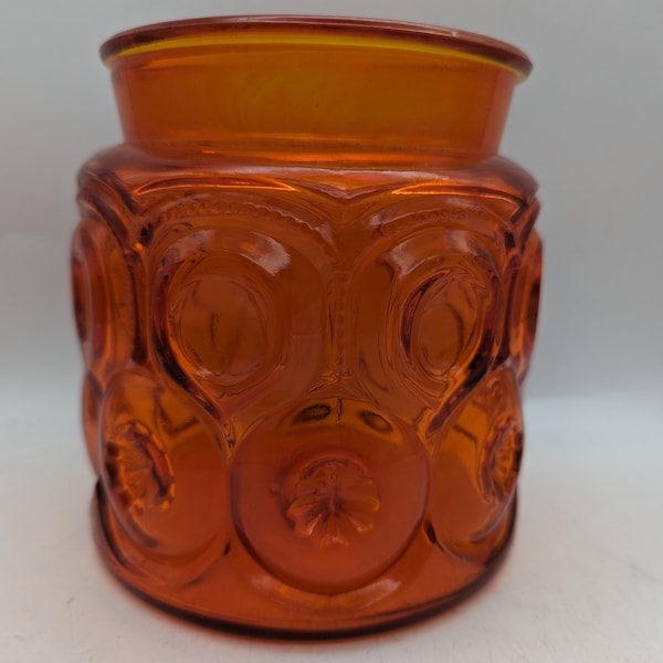 Vintage embossed orange glass jar - pre owned