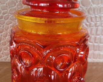 Vintage orange embossed glass jar with lid-pre owned