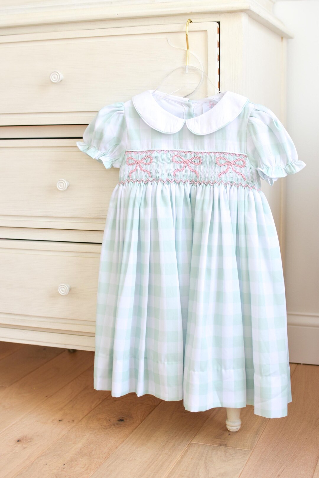 Pink alpaca hand smocked gingham dress