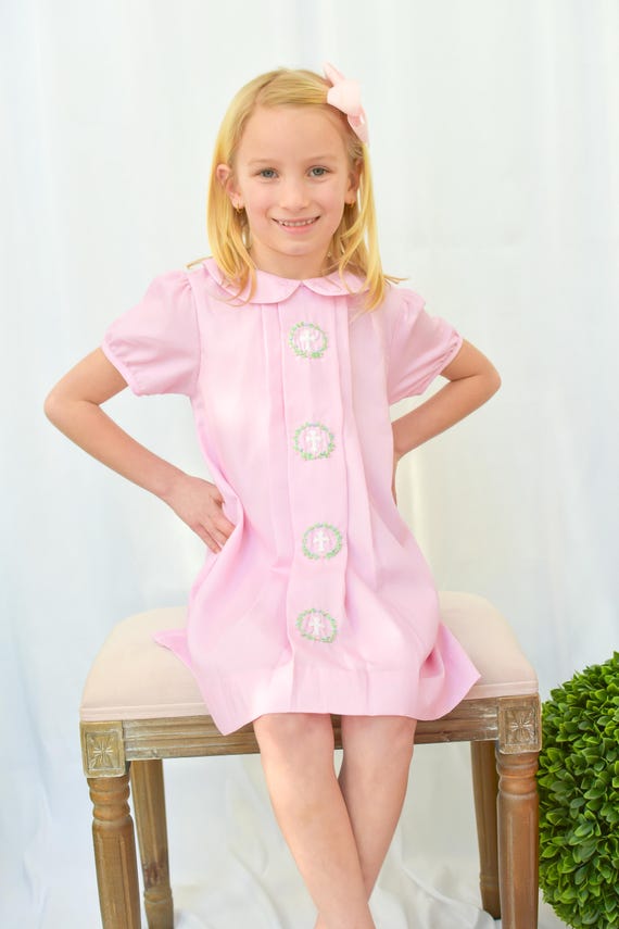 smocked cross dress Sunday Best while the lightweight material ensures comfort throughout the day. Abigail Smocked Cross Wreath Dress