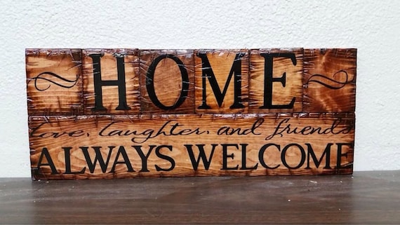 Home  Always Welcome sign