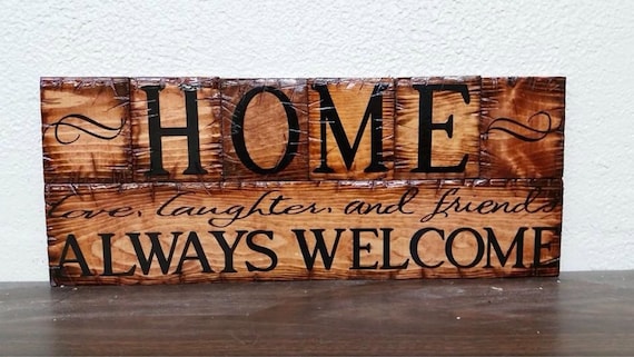 Home  Always Welcome sign