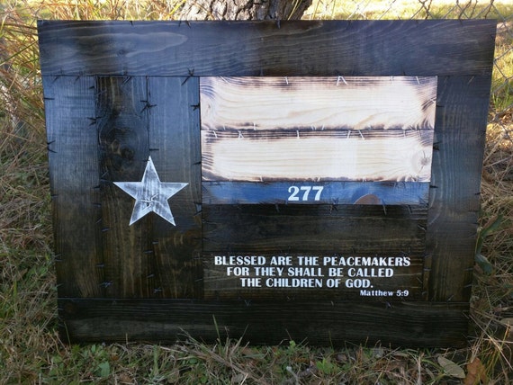 Framed thin blue line Texas flag with Peacemakers verse