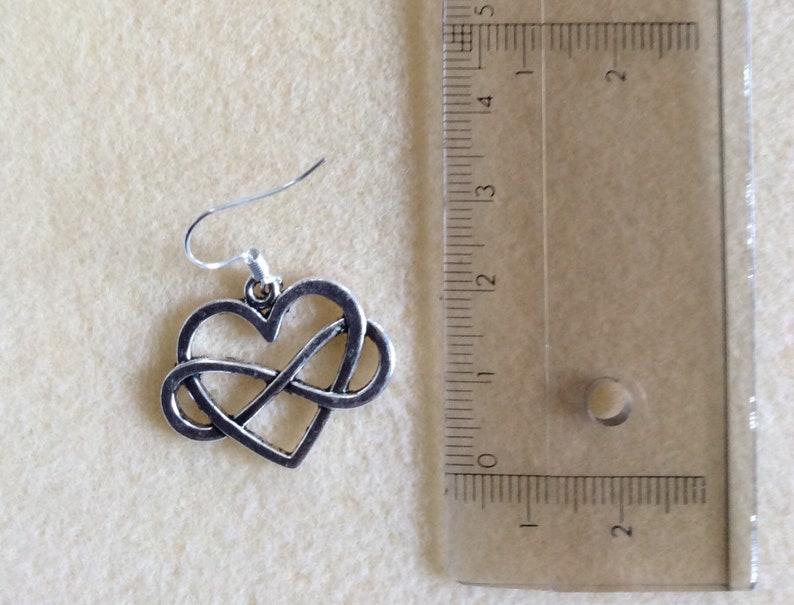 in silver metal endless love Infinity love earrings heart