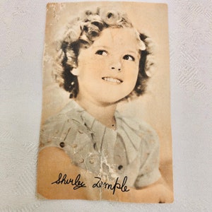 Briefkaart met handtekening Shirley Temple uit de jaren 30.