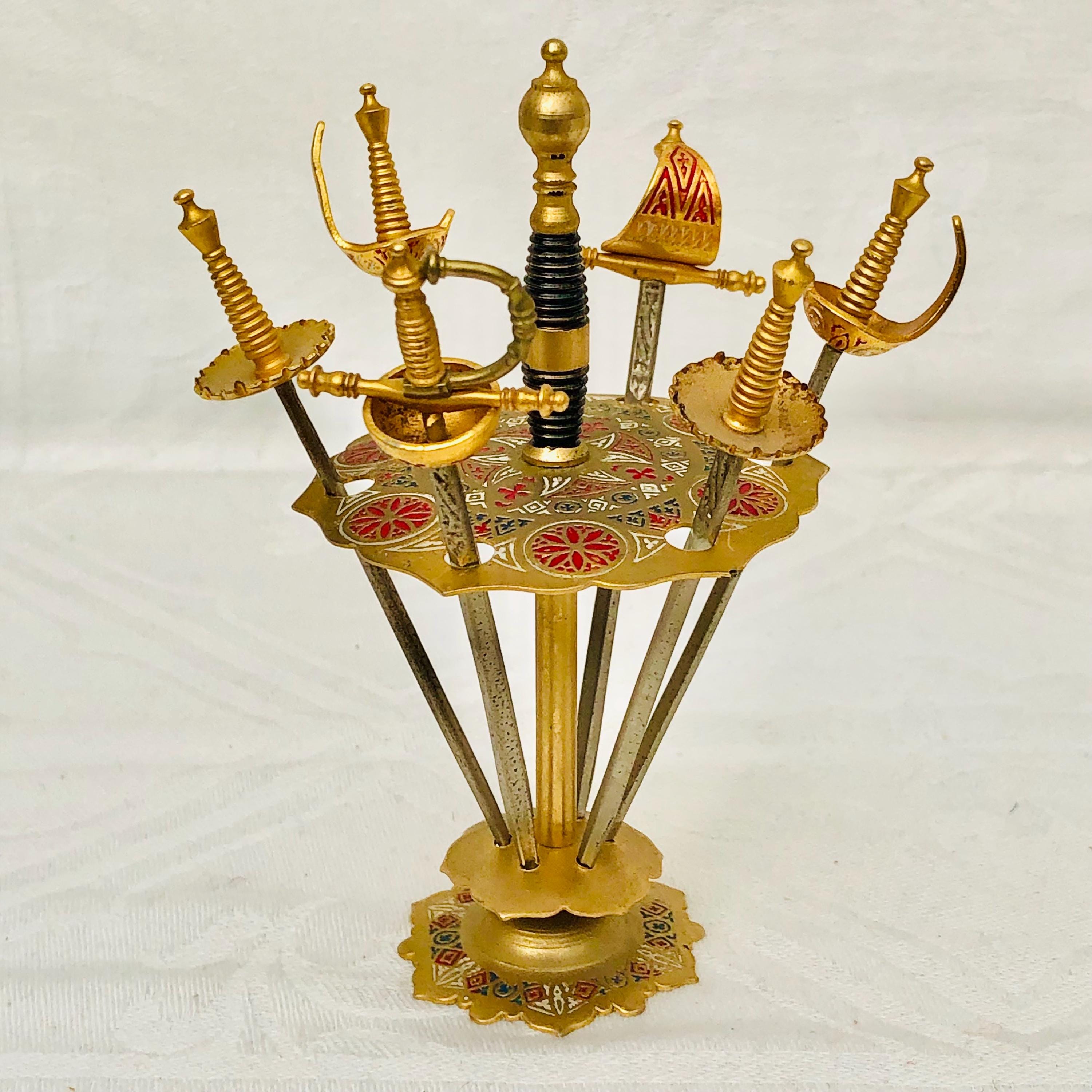 1960s Spanish Toledo Steel Miniature Swords Cocktail Picks On A Stand, Enamelled Designs Gold-Tone Set Of 6.