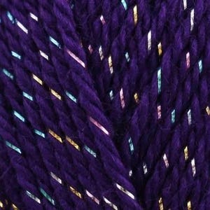 May include: Close-up of a skein of dark purple yarn with metallic strands of gold, silver, and light blue. The yarn has a textured appearance, with visible twists and fibres. Ideal for knitting and crochet projects.