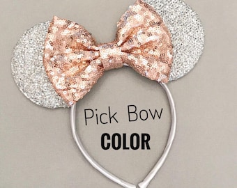 May include: Silver glitter mouse ears headband with a rose gold sequin bow. Pick Bow Color.