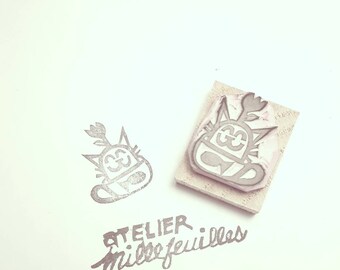 Small print of cat in a cup 2.5 cm x 3 cm