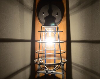skiLIte is a wall sconce made from an upcycled vintage wood waterski and is perfect for your lake house or waterside retreat.