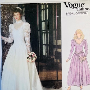 May include: Vogue Patterns Bridal Original sewing pattern. The pattern features a white wedding dress with long lace sleeves and a high neckline. A drawing of a lavender dress is also shown. The pattern number is 1092.