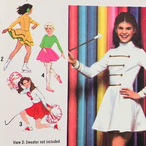 May include: A sewing pattern envelope labeled 9155 for young junior and teen sizes 13/14 and 15/16. The front displays illustrations of four different outfits including a white drum major style dress with gold trim, a yellow dress, and skirts.