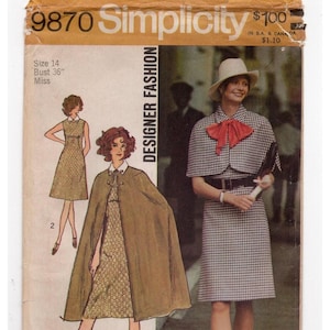 May include: Simplicity sewing pattern 9870 for a miss size 14, bust 36 inch. The envelope features illustrations of a sleeveless dress and a matching cape, alongside a photograph of a person wearing a gingham dress and cape with a red necktie.