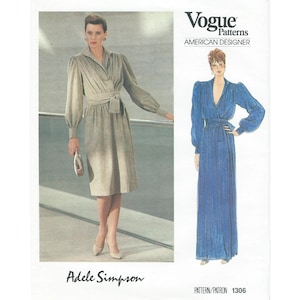 May include: Vogue Patterns sewing pattern featuring an Adele Simpson design. The cover shows a woman in a light gray wrap dress with a matching belt and a blue dress illustration. The text "American Designer" is visible.