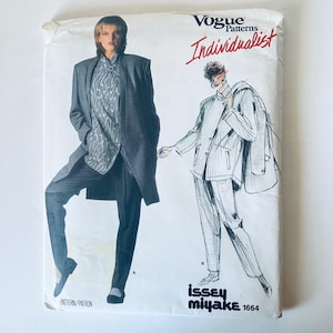 May include: A Vogue Patterns Individualist sewing pattern envelope for Issey Miyake design 1664. The front features a photograph of a person in a grey blazer and patterned trousers, alongside a black and white sketch of the same outfit.