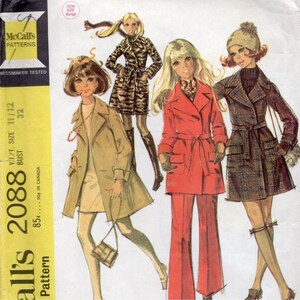 May include: A vintage McCall's 2088 sewing pattern envelope featuring illustrations of four outfits: a tan trench coat, a tiger-print coat, a red belted jacket with matching trousers, and a plaid coat with a matching hat, all in a 1960s style.