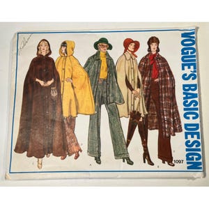 May include: Vintage Vogue's Basic Design sewing pattern featuring illustrations of capes and coats. The cover art showcases figures in various styles, including a brown hooded cape, a yellow hooded cape, and a plaid cape. The pattern number is 1097.