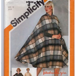 May include: A Simplicity sewing pattern envelope for a size 12 miss cape. The cover features a plaid cape in shades of tan, grey, white, and black with a double-breasted button closure. The text includes Simplicity, size 12, and miss.