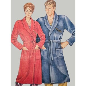 May include: Illustration of two people wearing robes. One robe is red, the other is blue. Both robes have pockets, a belt, and the word "McCall's" embroidered on the chest. The background is a solid gray.