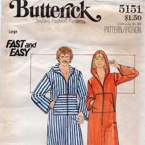 May include: A Butterick 5151 sewing pattern envelope for a hooded robe in size Large. The illustration shows two people wearing zip-front robes with front pockets, one in a blue and white striped fabric and the other in a solid orange fabric.