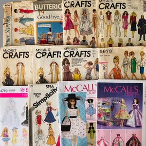 May include: A collection of vintage sewing patterns for dolls, featuring various brands like McCall's, Butterick, and Simplicity. The paper envelopes display illustrations of dolls wearing diverse outfits, including dresses, gowns, and casual wear, with printed text and pricing visible on the covers.