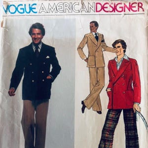 May include: A Vogue American Designer sewing pattern envelope featuring illustrations of three outfits. One shows a dark navy double-breasted blazer with tan trousers, another a tan double-breasted suit, and the third a red double-breasted blazer with plaid trousers.