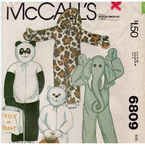 May include: A McCall's sewing pattern envelope 6809 featuring illustrations of four animal costumes: a panda, a leopard, a cat, and an elephant. The panda holds a white trick or treat bag. The cover includes the brand name and text details.