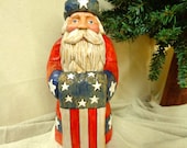 Hand carved wood American Santa sculpture holding a Revolutionary era American flag Patriotic quilt santa carved wood figure 
