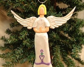 Hand carved wood, lilac angel ornament by Dan and Debbie Easley #88